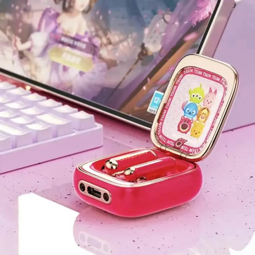Disney Mickey and Minnie earbuds displayed beside a keyboard