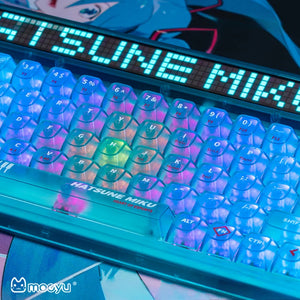 Cyan Hatsune Miku keycaps illuminated by RGB backlighting